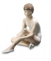 Sitting ballerina holding her knee, Royal Copenhagen figurine