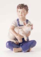 Boy with piglet, Royal Copenhagen figurine