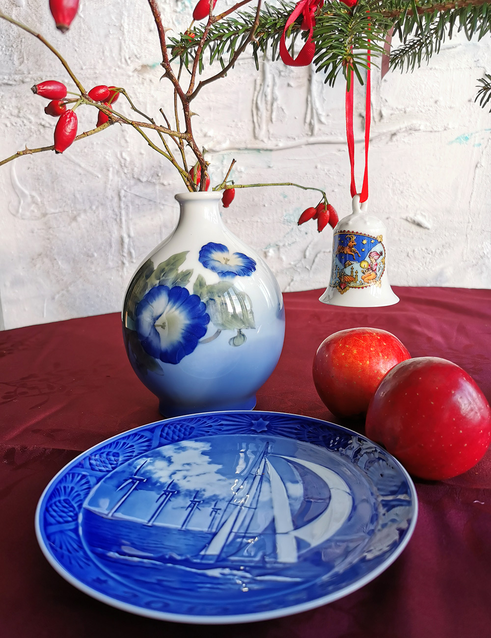 Royal Copenhagen porcelain vase paired with a beautiful Royal Copenhagen Christmas plate and a Hutschenreuther Christmas bell