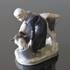 Girl feeding a Calf from a bucket, Royal Copenhagen figurine no. 779 | No. 1021075 | Alt. R779 | DPH Trading