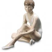 Sitting ballerina holding her knee, Royal Copenhagen figurine
