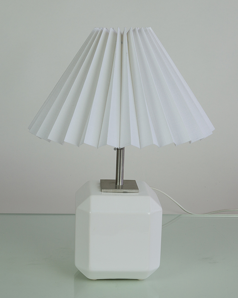 Stainless steel tube on plate - can be used for e.g. lamp mounting. Height 10 cm