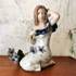 Young Lady with daisies in spotted dress, Karen, Royal Copenhagen figurine | No. 5021008 | DPH Trading