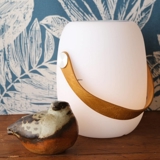 Combined LED lamp and Bluetooth speaker in white with leather strap, rechargeable