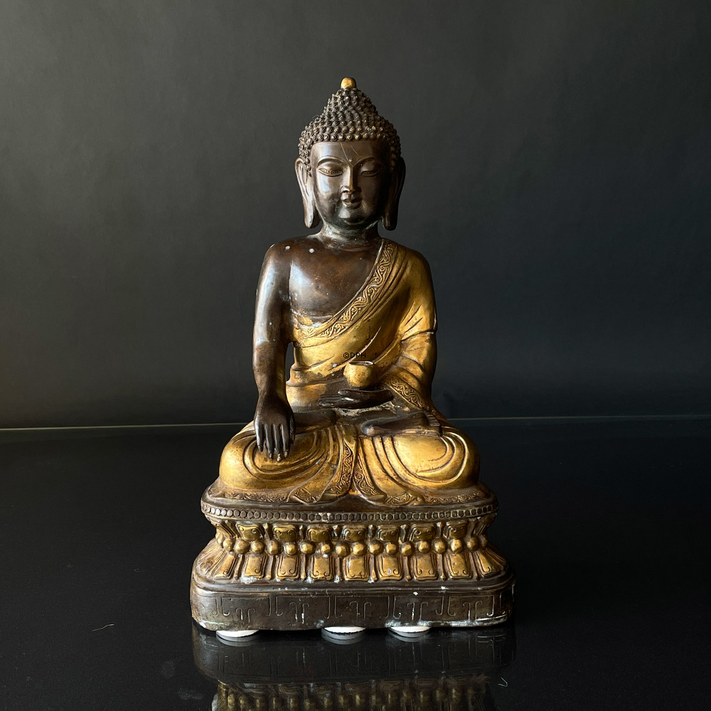 Buddha figure in brown and golden paint