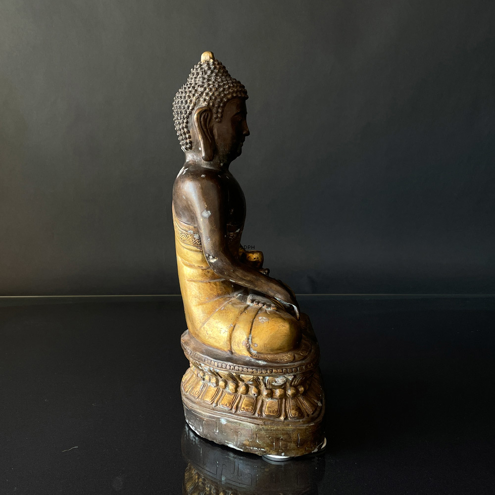 Buddha figure in brown and golden paint