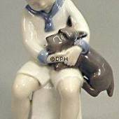 Boy sitting with Dog, Bing & Grondahl figurine No. 2201