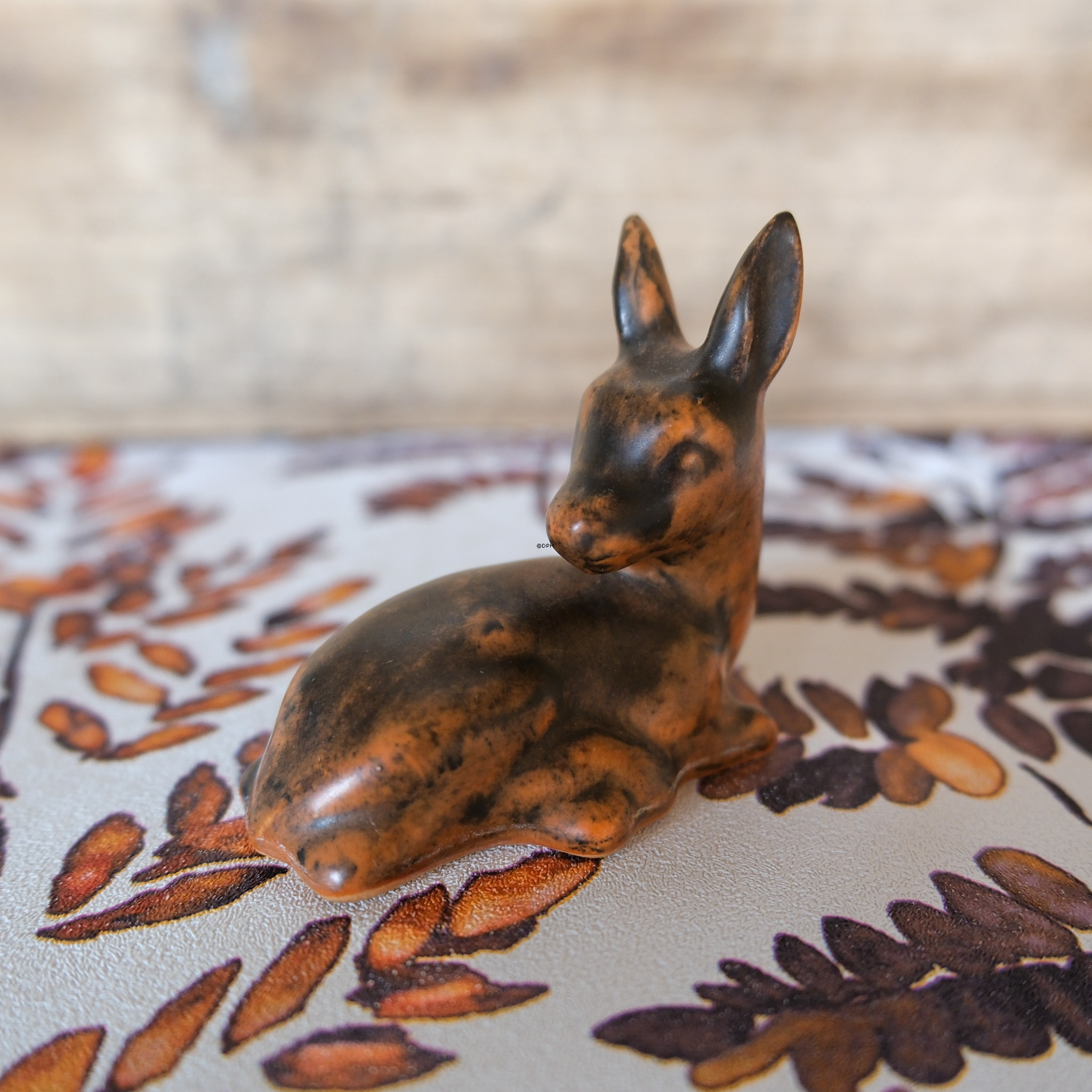 Johgus ceramic fawn lying down