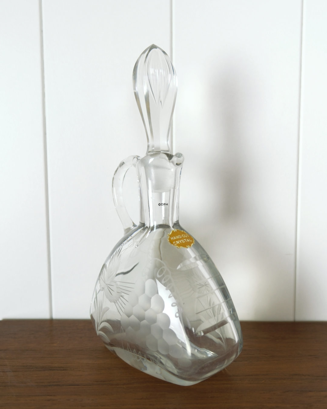 Crystal carafe with hand-cut grape motif