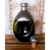 Triangular decanter in green glass with pewter coating