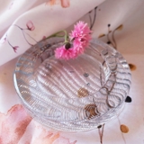 Glass bowl with ribbed pattern at the bottom, solid glass