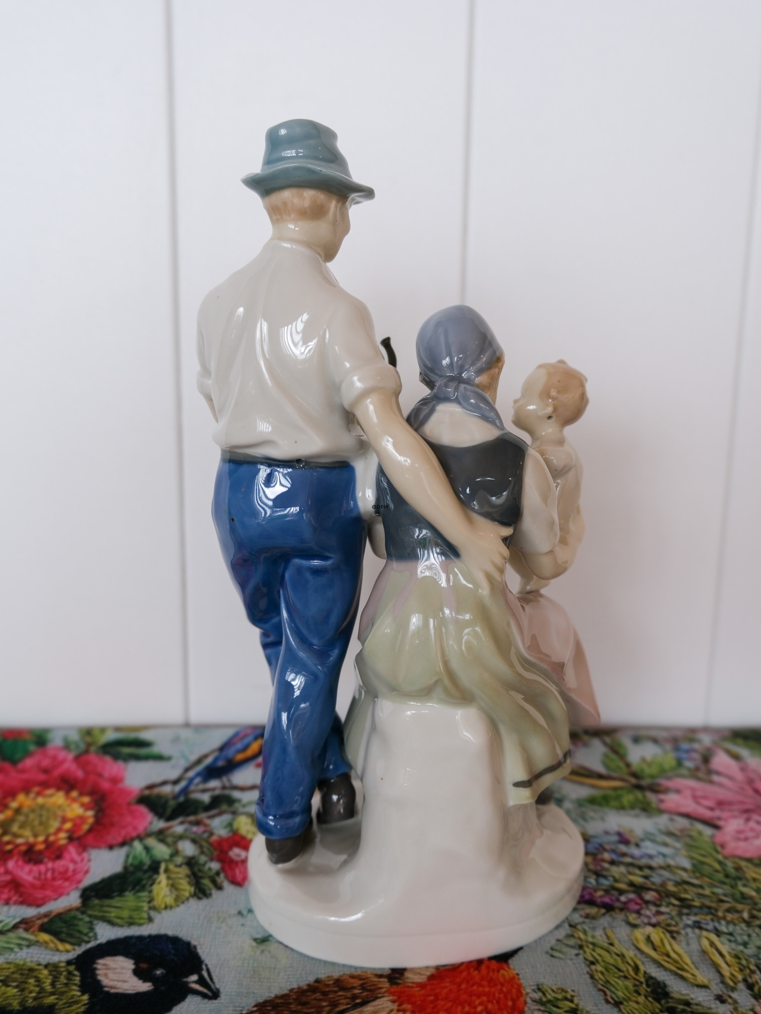 Family, mother and father with baby, marked GDR no. 8834