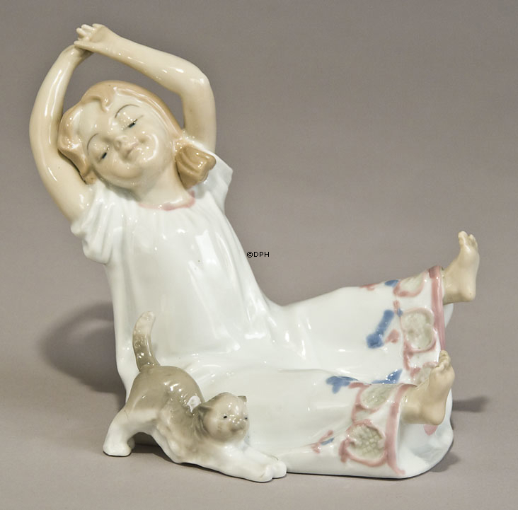 Girl with kitten stretching together