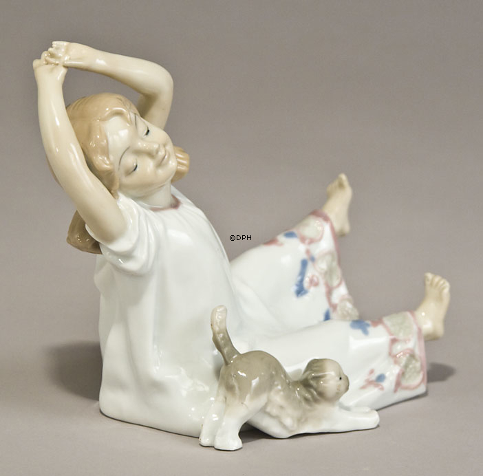 Girl with kitten stretching together