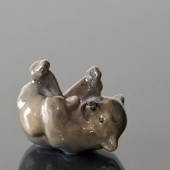 Brown bear lying down playing with its Foot, Royal Copenhagen figurine No. ...