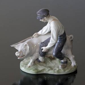 Swineherd leading the pig, Boy with pig, Royal Copenhagen figurine No. 848 | No. R848 | DPH Trading