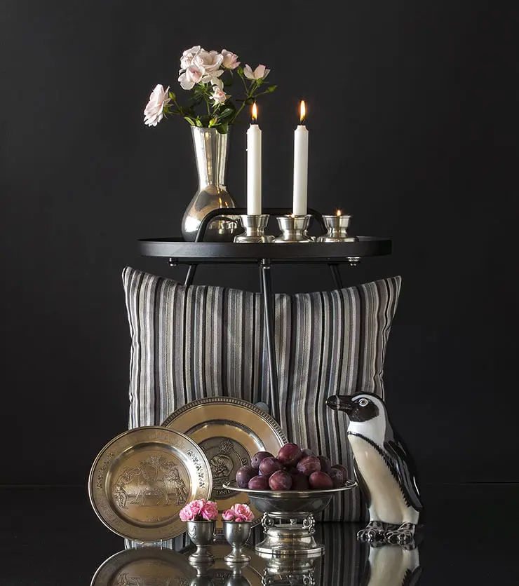 Pewter Tin plates together with pinguin figurine, Tin egg cups, tin candleholders and a tin vase