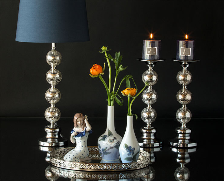 Royal Copenhagen B&G vases and Karen figurine on mirrored tray along with Table lamp and candle holders