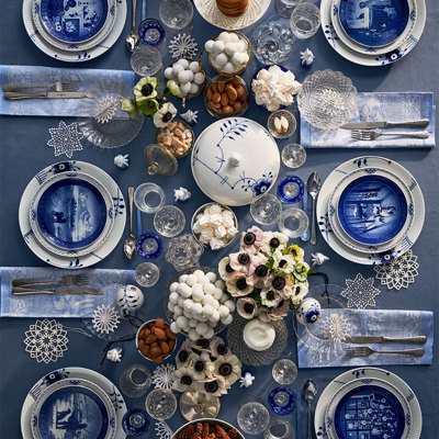 Festive blue and white table setting with Royal Copenhagen Christmas plates and dinnerware. Inspiration for proper table settings for weddings, confirmations, christenings, birthdays, or Christmas lunches.