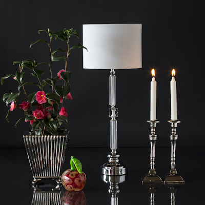 Large metal herb pot with glass apple table lamp and candle holders