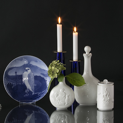 Plate with Icelandic falcon, Asmussen candlesticks, and Royal Copenhagen vases and jars