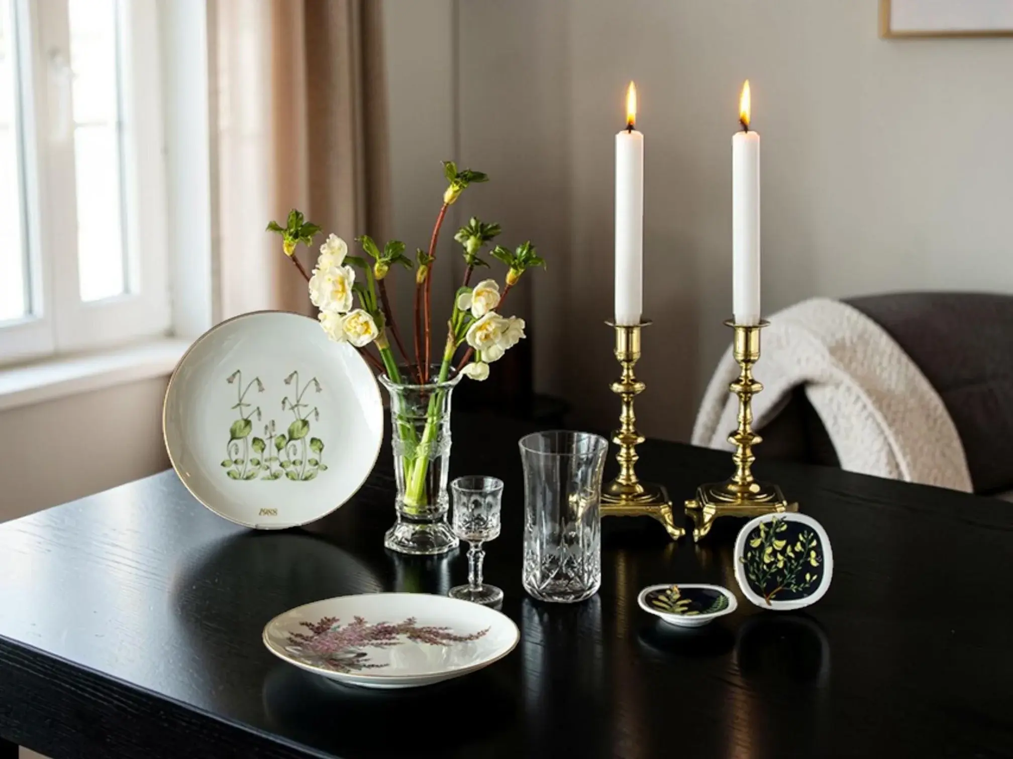 Hackefors Mother's Day plates on table with candles and Rörstrand plaquettes
