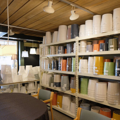 Wide selection of lampshades in all colors and shapes at the Danish Porcelain House – shelves filled with shades and the opportunity for personal guidance in the store.