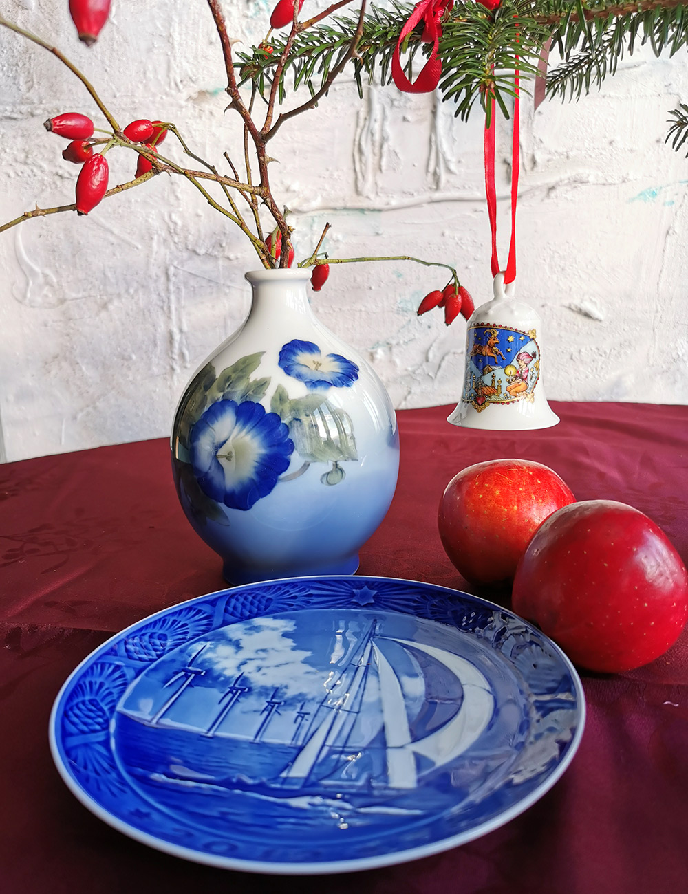 Hutschenreuther Christmas Bell 1979 with the title 'Alpenland (Ibex)', designed by Ole Winther, along with Royal Copenhagen vase and Christmas plate.