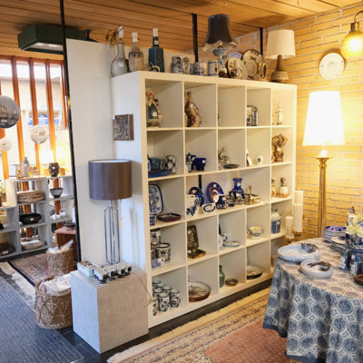 Display with figurines, plates, vases, and porcelain in blue and white tones at the Danish Porcelain House store in Odense, Denmark.