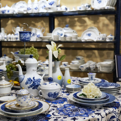 Table display with Royal Copenhagen Blue Flower and other dinnerware at the Danish Porcelain House in Odense, Denmark – porcelain for coffee, dining, and serving.