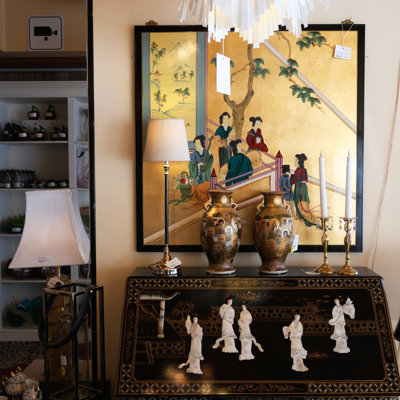 Chinese writing desk in black lacquer with golden decorations and motifs of white ladies – displayed at the Danish Porcelain House in Odense, Denmark.